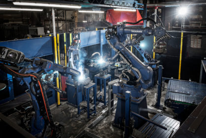 Smoothly integrating a welding power source into a robotic welding system