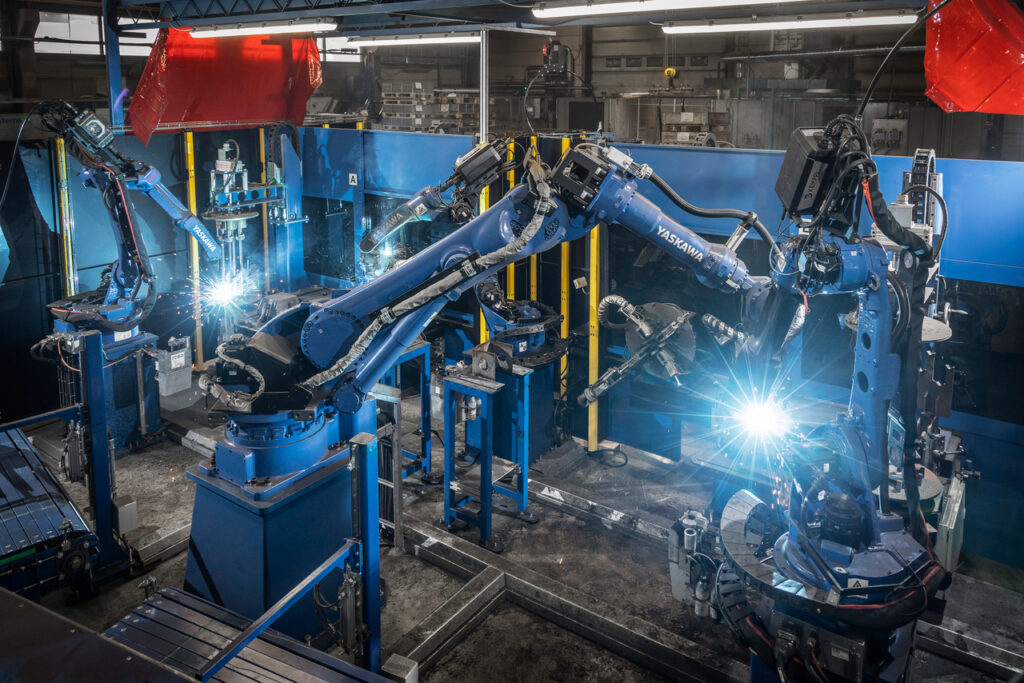 In this picture you can see two robots welding.